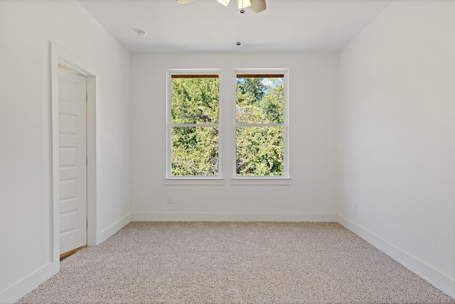 spare room with carpet floors and ceiling fan