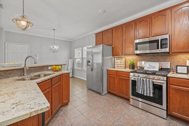 kitchen featuring decorative light fixtures, sink, stainless steel appliances, ornamental molding, and a chandelier