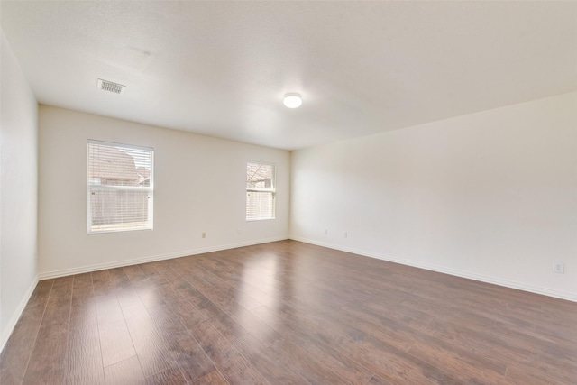 empty room featuring dark hardwood / wood-style floors