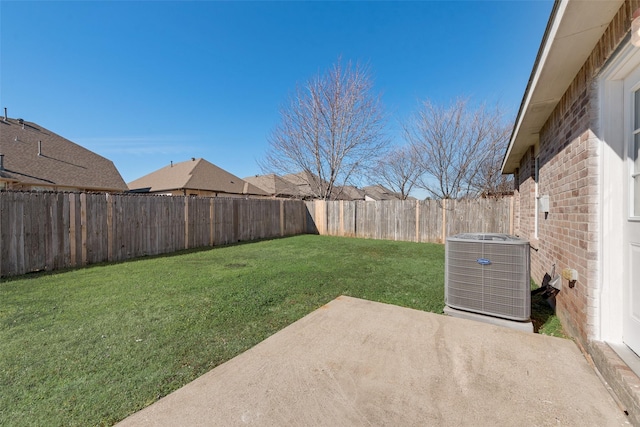 view of yard featuring central AC and a patio