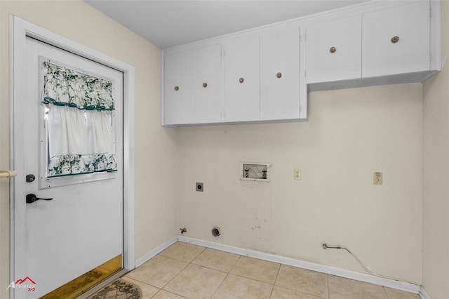 laundry room featuring washer hookup, cabinets, hookup for an electric dryer, and hookup for a gas dryer