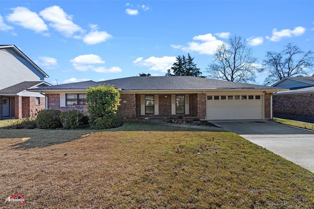 ranch-style home featuring a garage and a front lawn