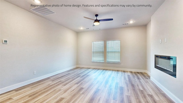 unfurnished room featuring ceiling fan and light hardwood / wood-style flooring