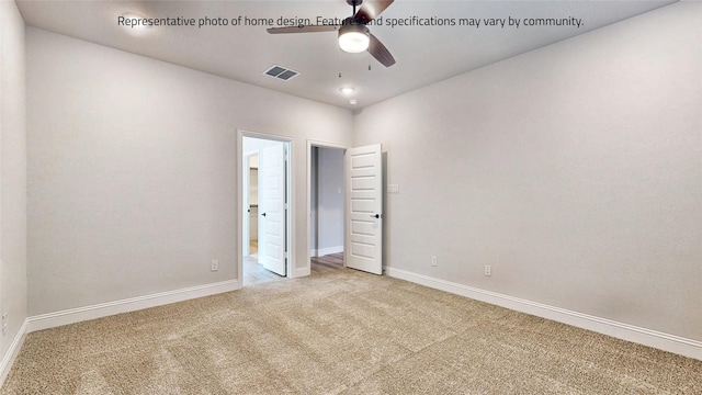 unfurnished room featuring ceiling fan and carpet flooring