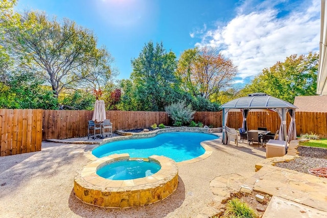 view of pool with an in ground hot tub, a gazebo, and a patio