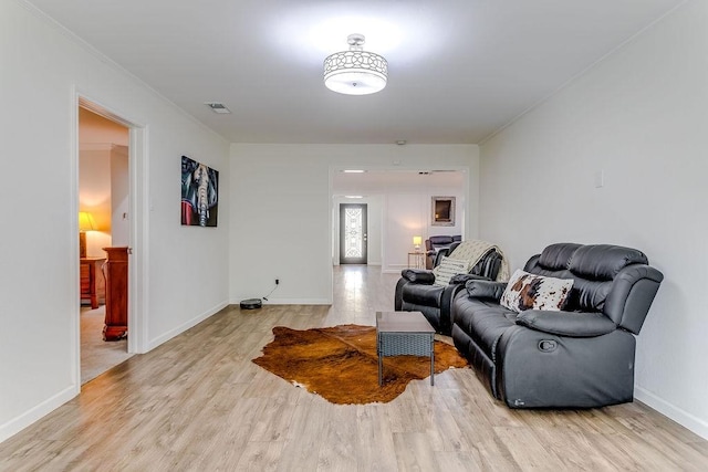 living room with light hardwood / wood-style flooring