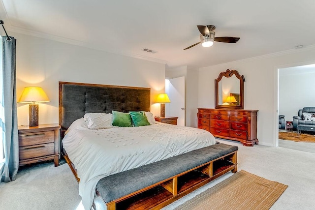 bedroom with ceiling fan, carpet floors, and ornamental molding