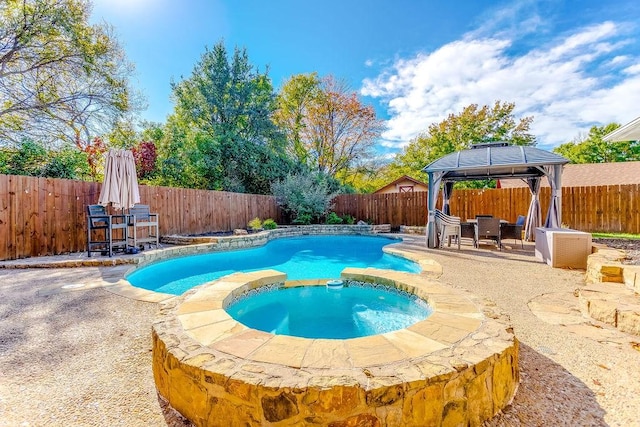 view of pool with a gazebo, an in ground hot tub, and a patio