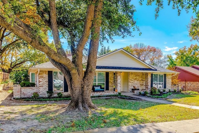 ranch-style home featuring a front yard