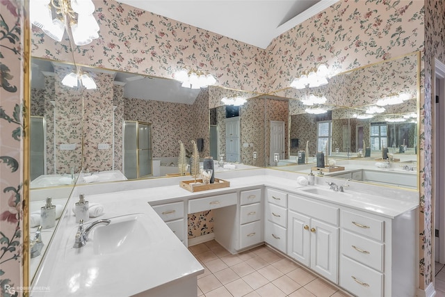 bathroom with tile patterned flooring, a shower with shower door, and vanity