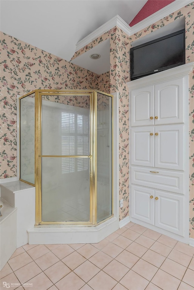 bathroom featuring a shower with shower door, vaulted ceiling, and tile patterned flooring