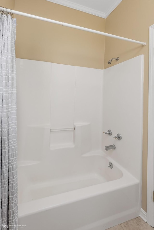 bathroom with tile patterned flooring, shower / bath combination with curtain, and ornamental molding