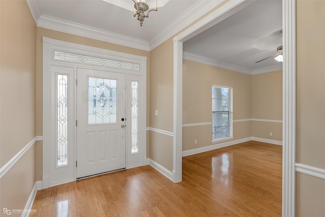 entrance foyer featuring light wood-type flooring and ornamental molding