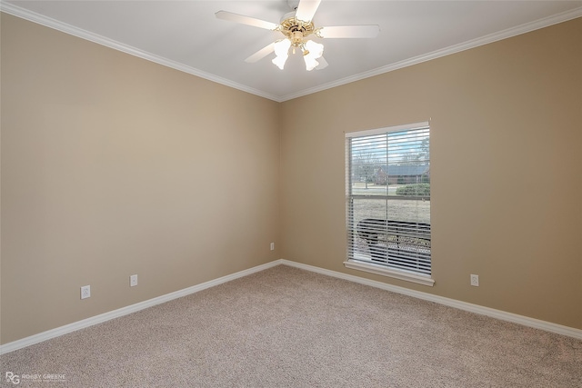 carpeted empty room featuring ceiling fan and ornamental molding