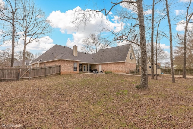 rear view of property with a patio area