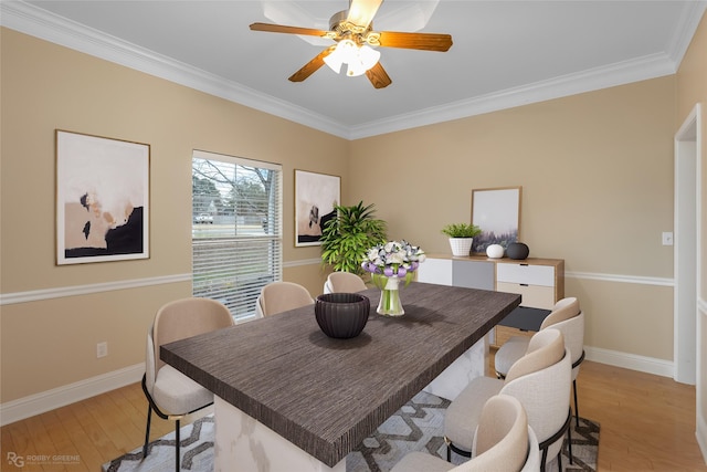 dining area featuring ceiling fan, ornamental molding, and light hardwood / wood-style floors