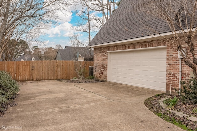 view of side of home with a garage