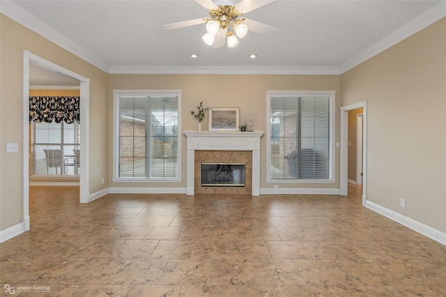 unfurnished living room featuring ceiling fan, crown molding, and a tile fireplace