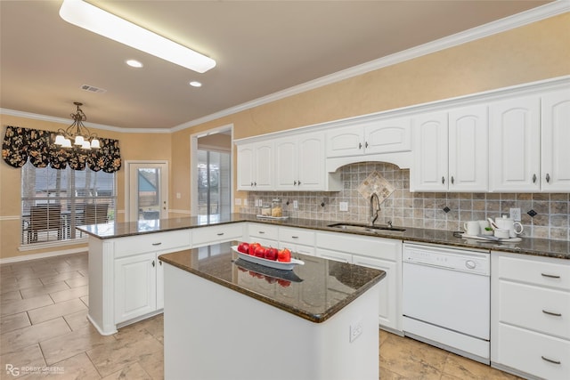 kitchen with sink, dishwasher, a notable chandelier, and a kitchen island