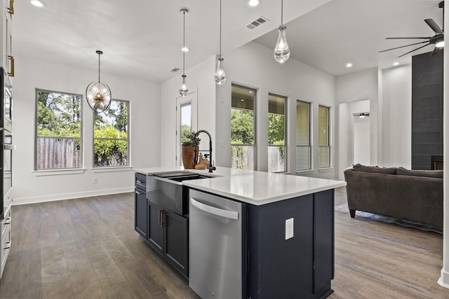 kitchen with sink, dark hardwood / wood-style floors, dishwasher, and a kitchen island with sink