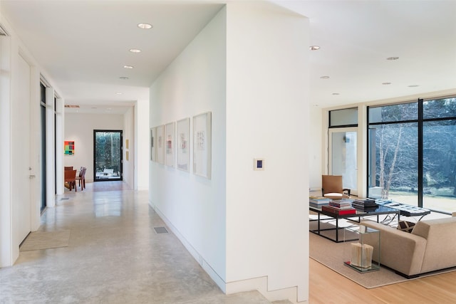 hallway with a wall of windows