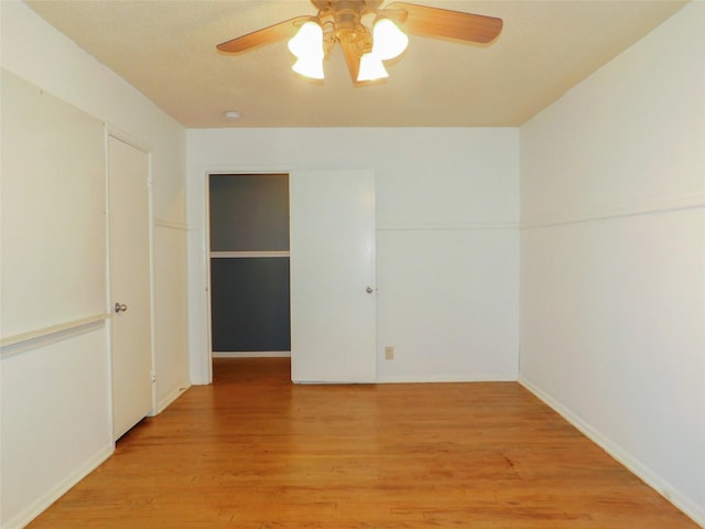 unfurnished room featuring ceiling fan and light hardwood / wood-style floors