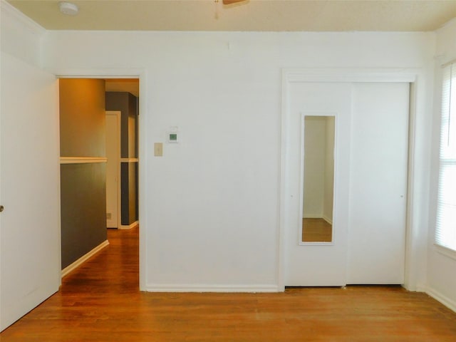 empty room featuring wood-type flooring