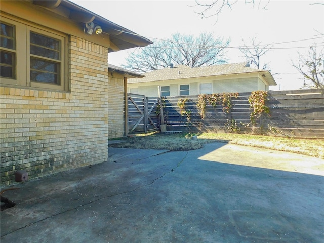 view of side of home with a patio