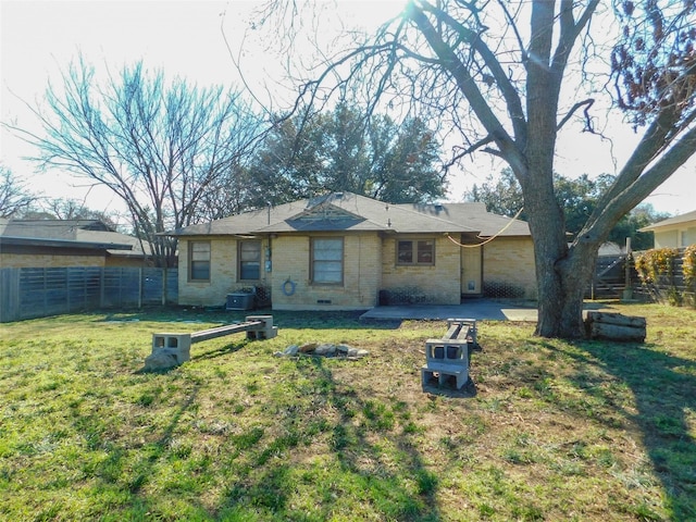 rear view of house with a patio area and a yard