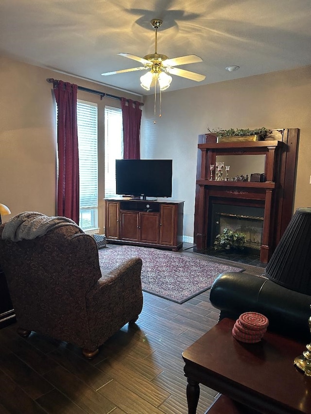 living room with hardwood / wood-style floors and ceiling fan