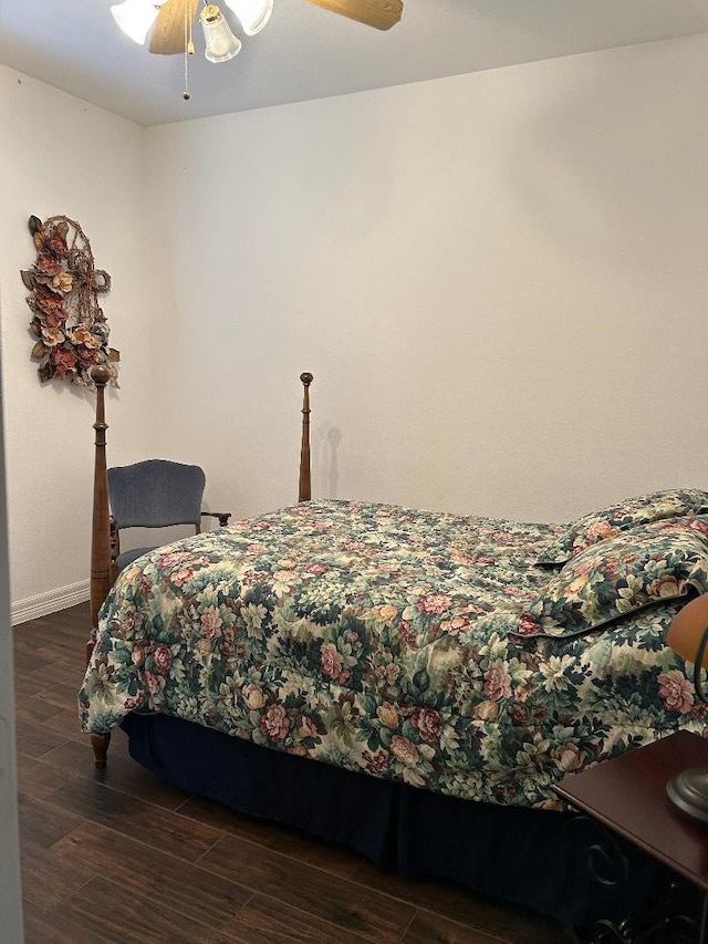 bedroom with ceiling fan and dark hardwood / wood-style floors