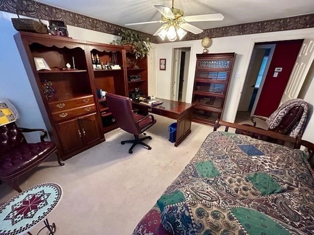 office featuring ceiling fan and light carpet