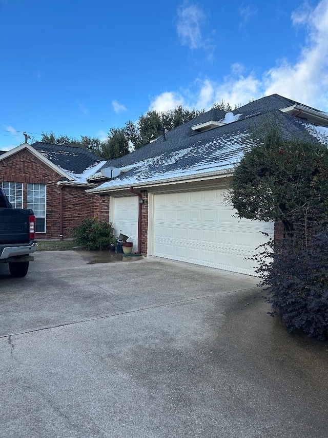 view of side of property featuring a garage