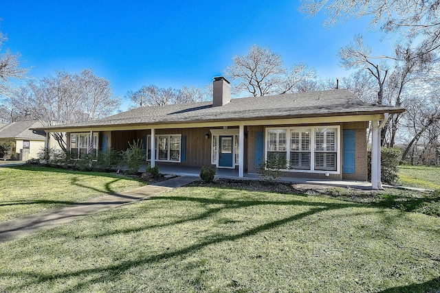 ranch-style house featuring a porch and a front lawn