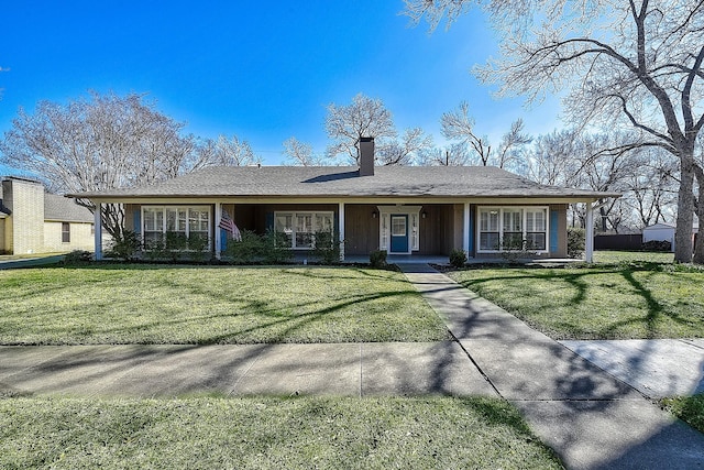 single story home with a front lawn