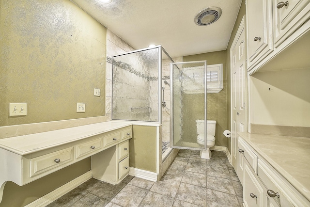 bathroom featuring vanity, toilet, and walk in shower