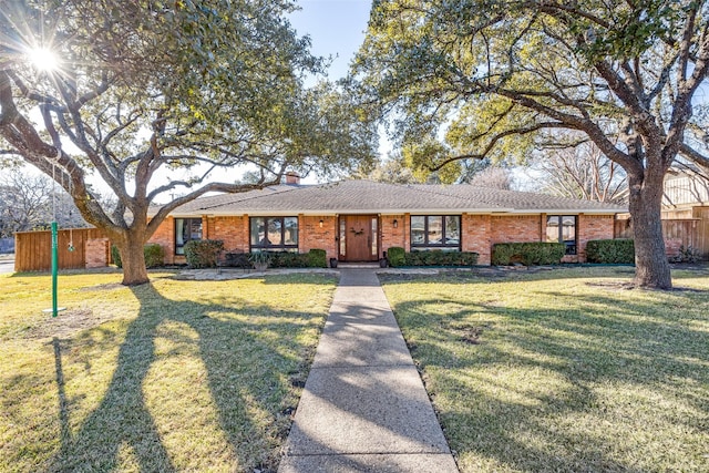 ranch-style house with a front lawn