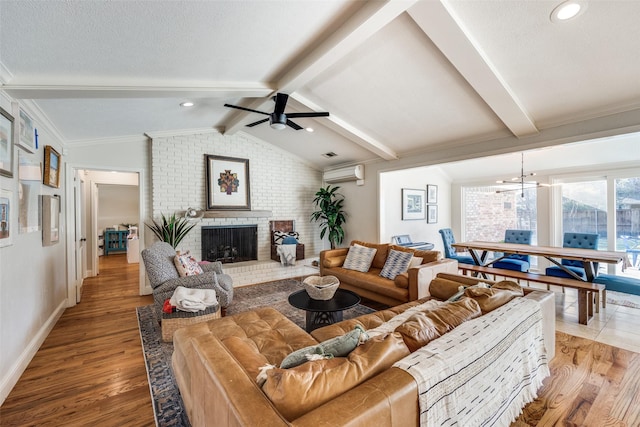 living room with a brick fireplace, light hardwood / wood-style flooring, an AC wall unit, and lofted ceiling with beams