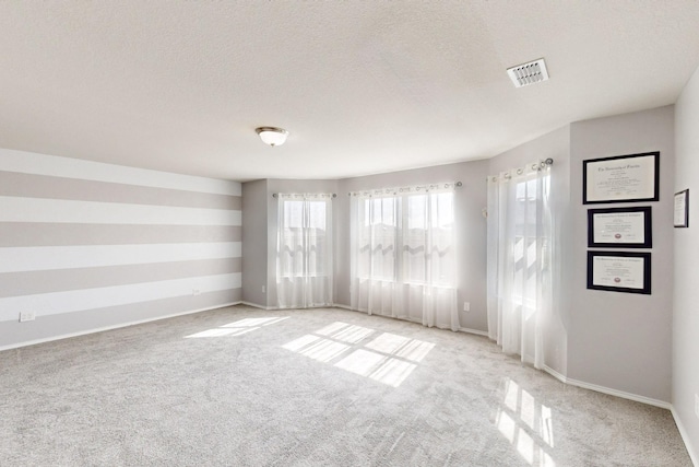 6217 Jackstaff Dr, Fort Worth, TX 76179 - carpeted empty room featuring a textured ceiling and baseboards