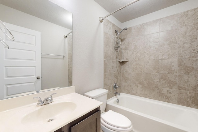 full bathroom with vanity, toilet, and tiled shower / bath combo