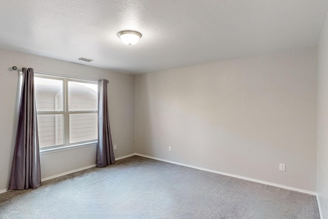 6217 Jackstaff Dr, Fort Worth, TX 76179 - spare room featuring carpet flooring, baseboards, and a textured ceiling