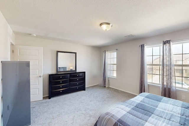 6217 Jackstaff Dr, Fort Worth, TX 76179 - carpeted bedroom featuring a textured ceiling and baseboards