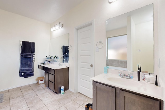 bathroom featuring tile patterned flooring and vanity