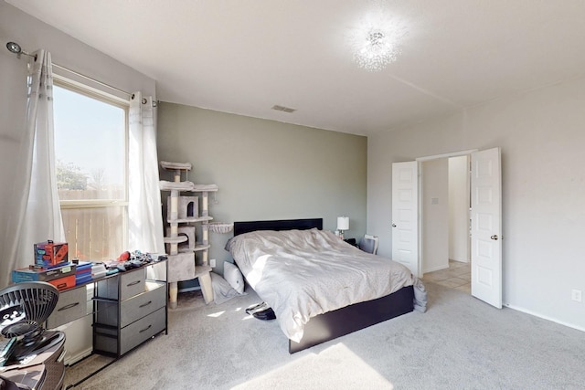 bedroom featuring light colored carpet