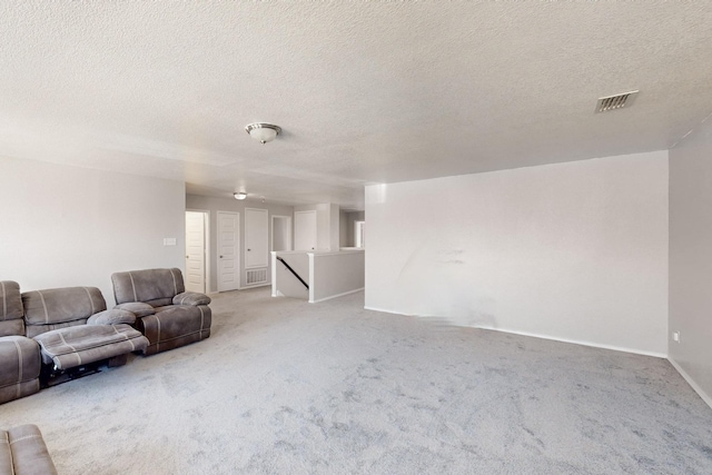 6217 Jackstaff Dr, Fort Worth, TX 76179 - living room featuring light colored carpet, a textured ceiling, and baseboards