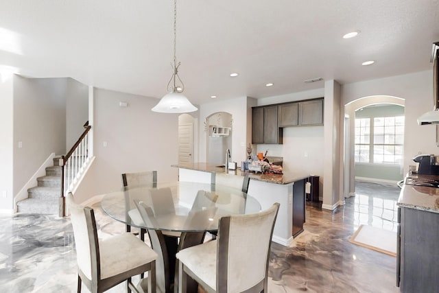 dining space featuring sink