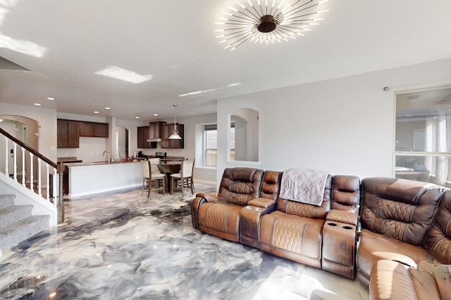 6217 Jackstaff Dr, Fort Worth, TX 76179 - living area with stairs, arched walkways, baseboards, and recessed lighting