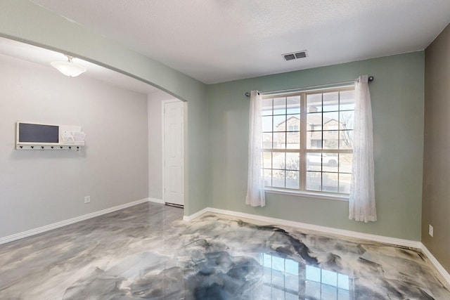 6217 Jackstaff Dr, Fort Worth, TX 76179 - empty room featuring arched walkways and baseboards