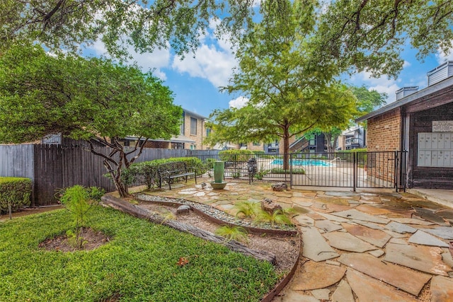 view of yard with a fenced in pool