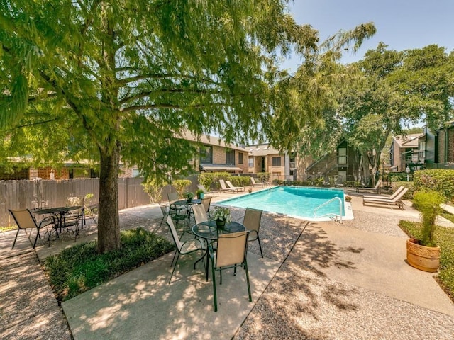 view of swimming pool with a patio area